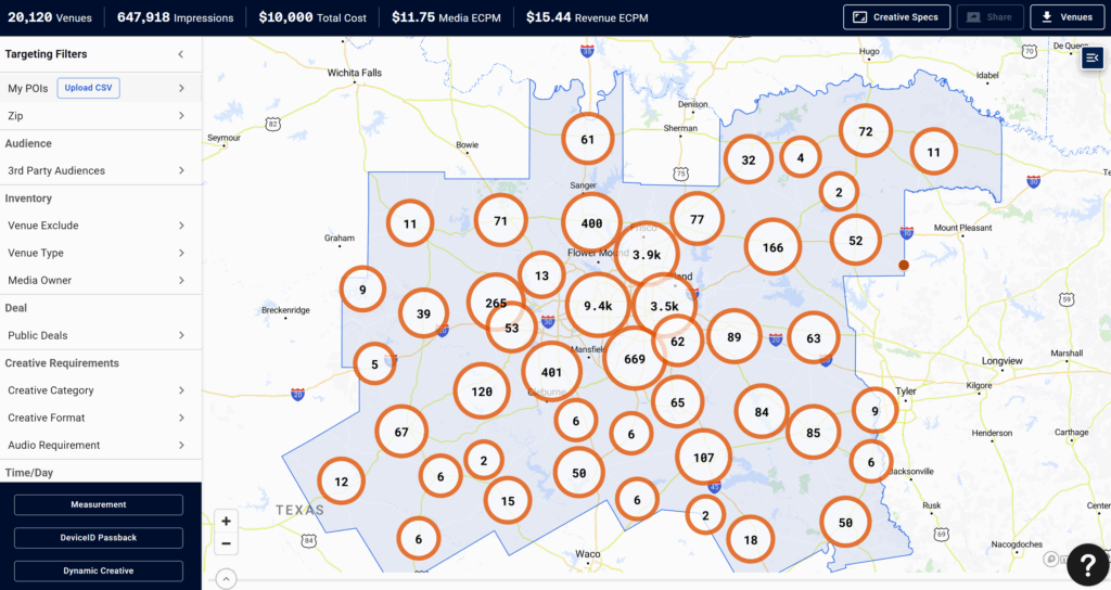 Digital billboards displaying data-driven advertising analytics by Quick Strike Media at night
